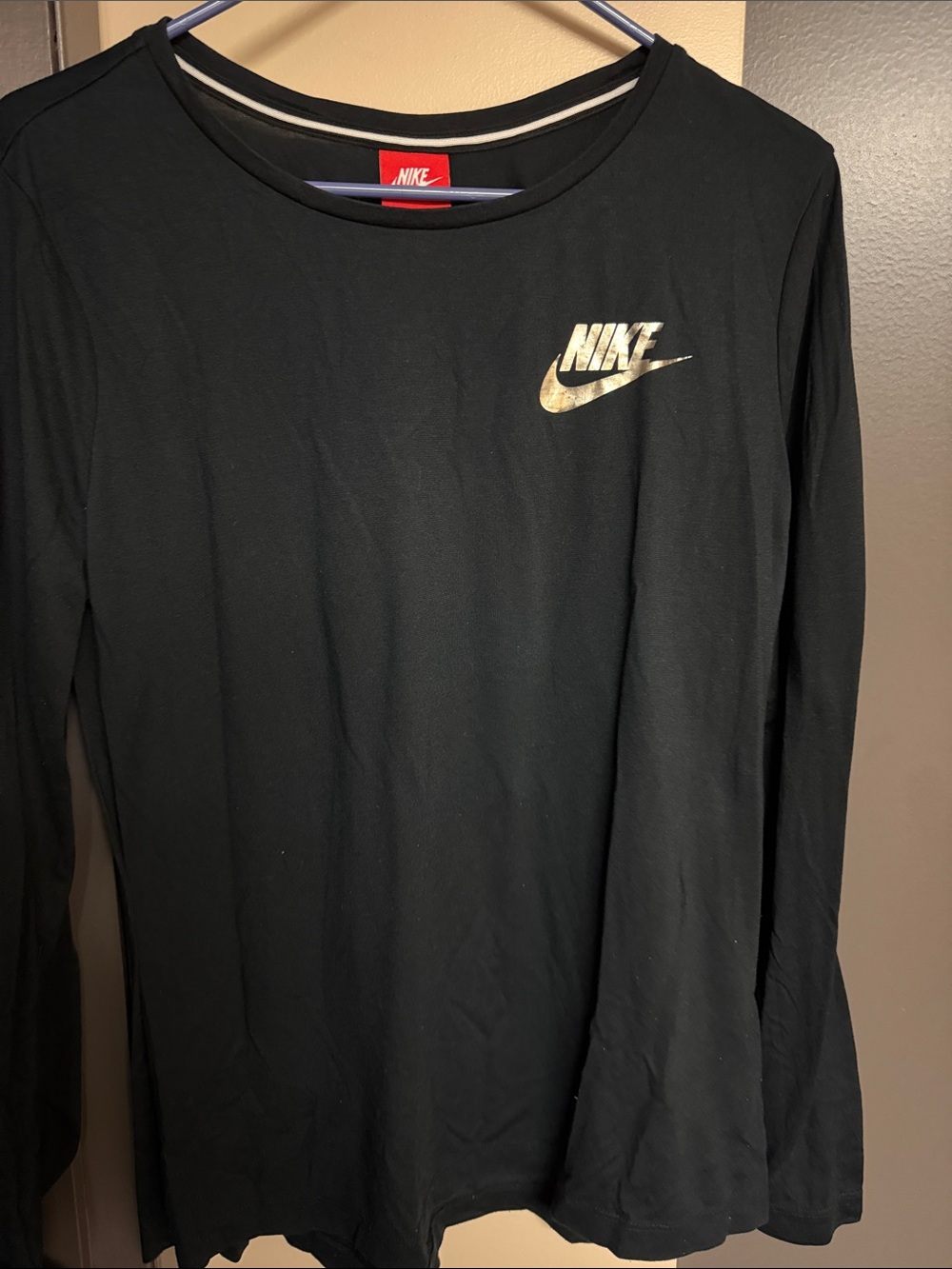 Nike Women’s Long-Sleeve Tee in Black with Metallic Gold Logo